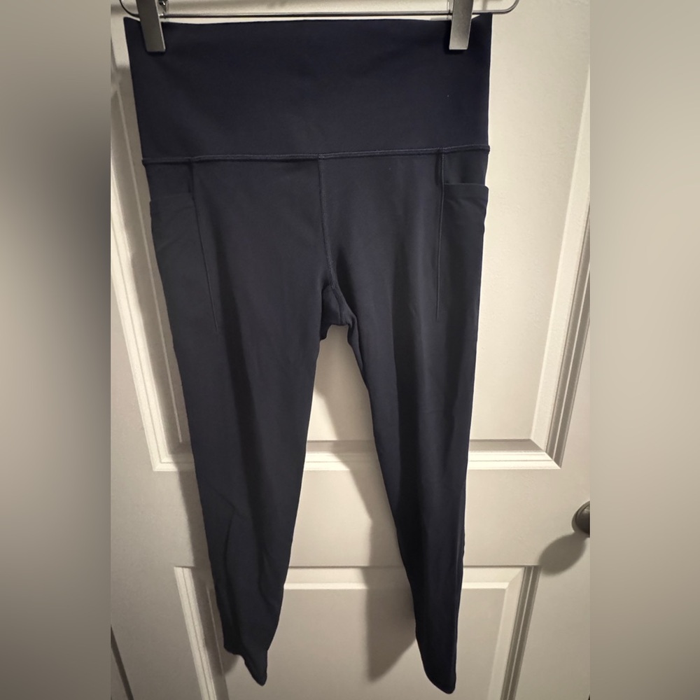 Athleta Salutation Stash Pocket II 7/8 Tight.   Size Small.  Navy